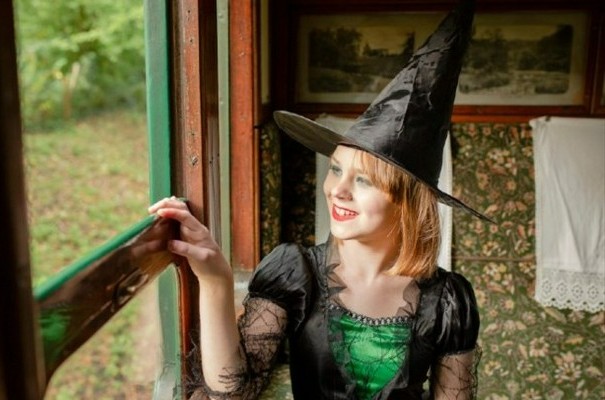 Girl dressed up as a witch on the Isle of Wight Steam Railway train