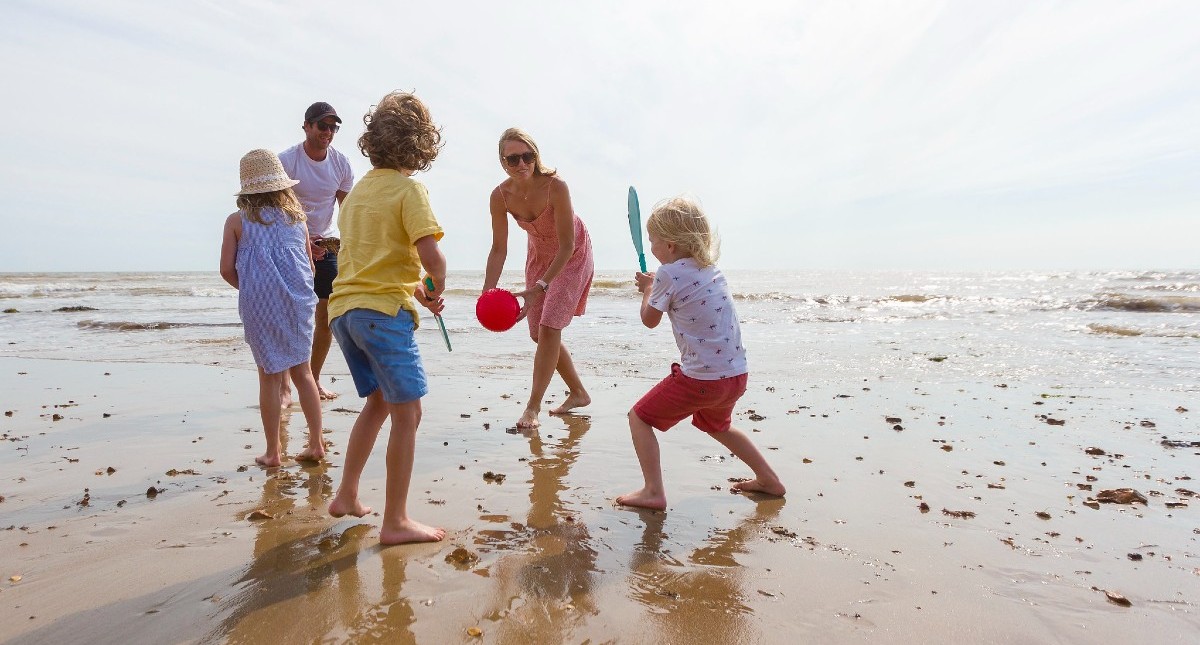 Family playing on Compton beach