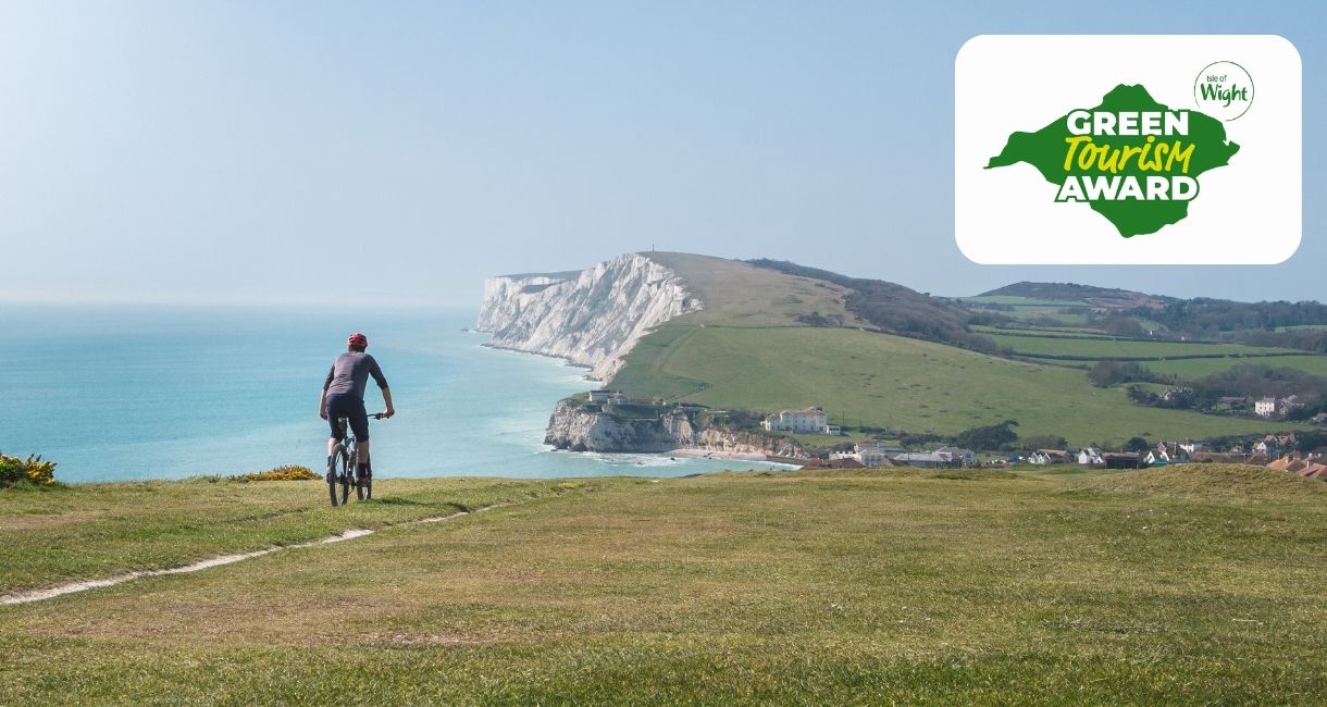 Cyclist riding along the cliff towards Freshwater, Isle of Wight