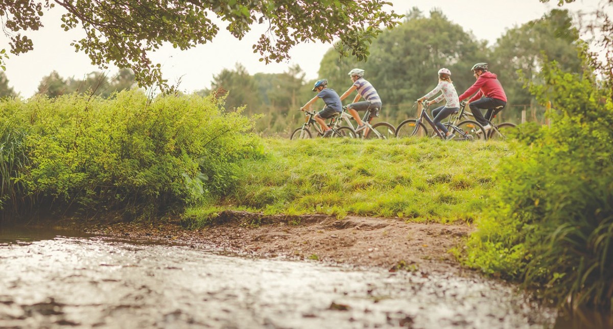 Family cycling along the Red Squirrel Trail