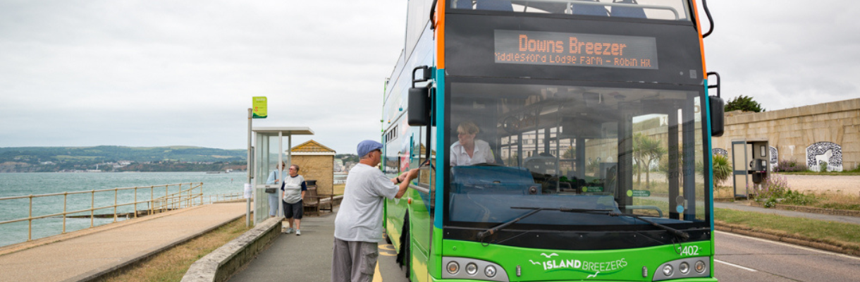 Southern Vectis bus driver helping a man on the Isle of Wight