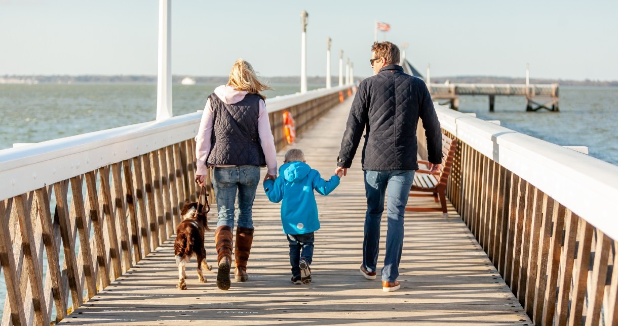 Family walking along Yarmouth pier