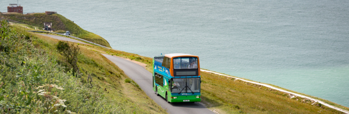 Needles Breezer bus driving from the Needles Battery on the Isle of Wight