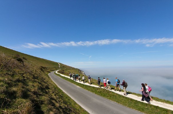 Group walking along the coastline